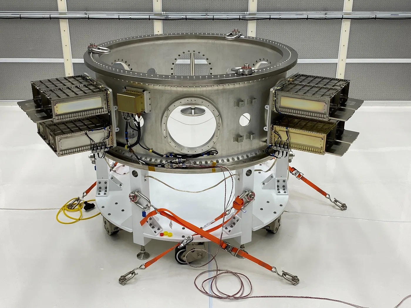 The Landsat 9 EELV Secondary Payload Adapter Flight System, with four canisterized dispensers mounted around the ring.